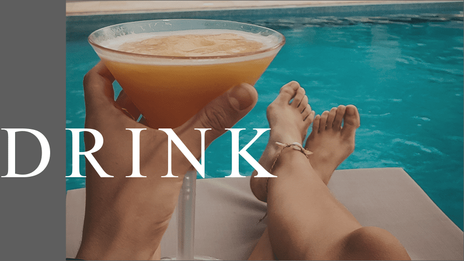 Drink cocktails by the pool